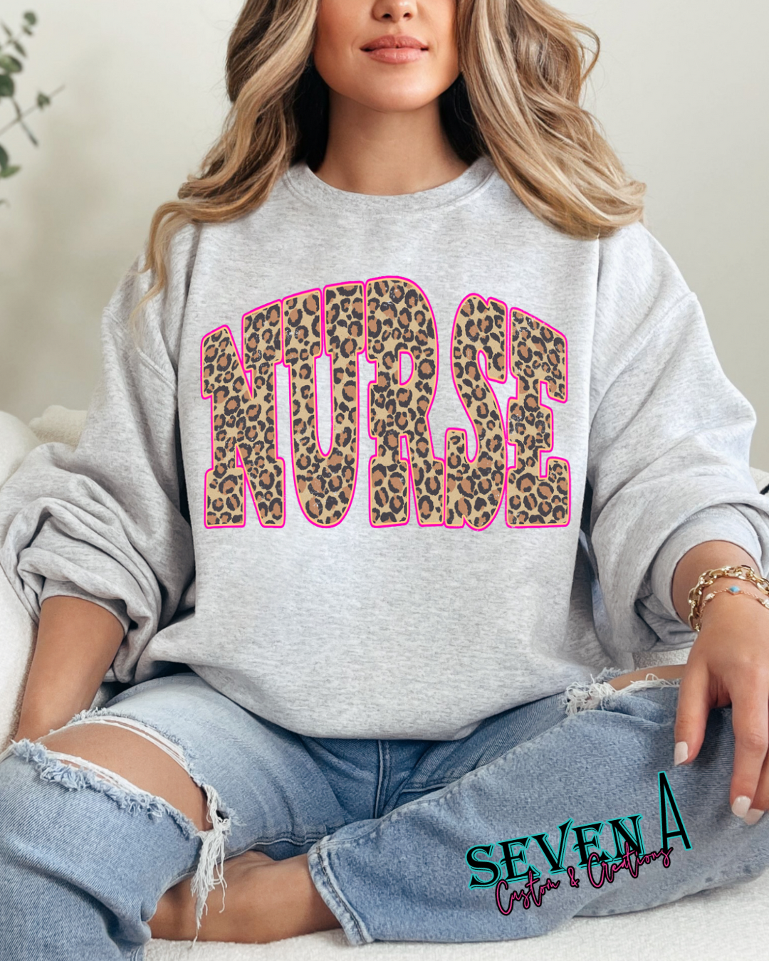 Leopard nurse trimmed in pink